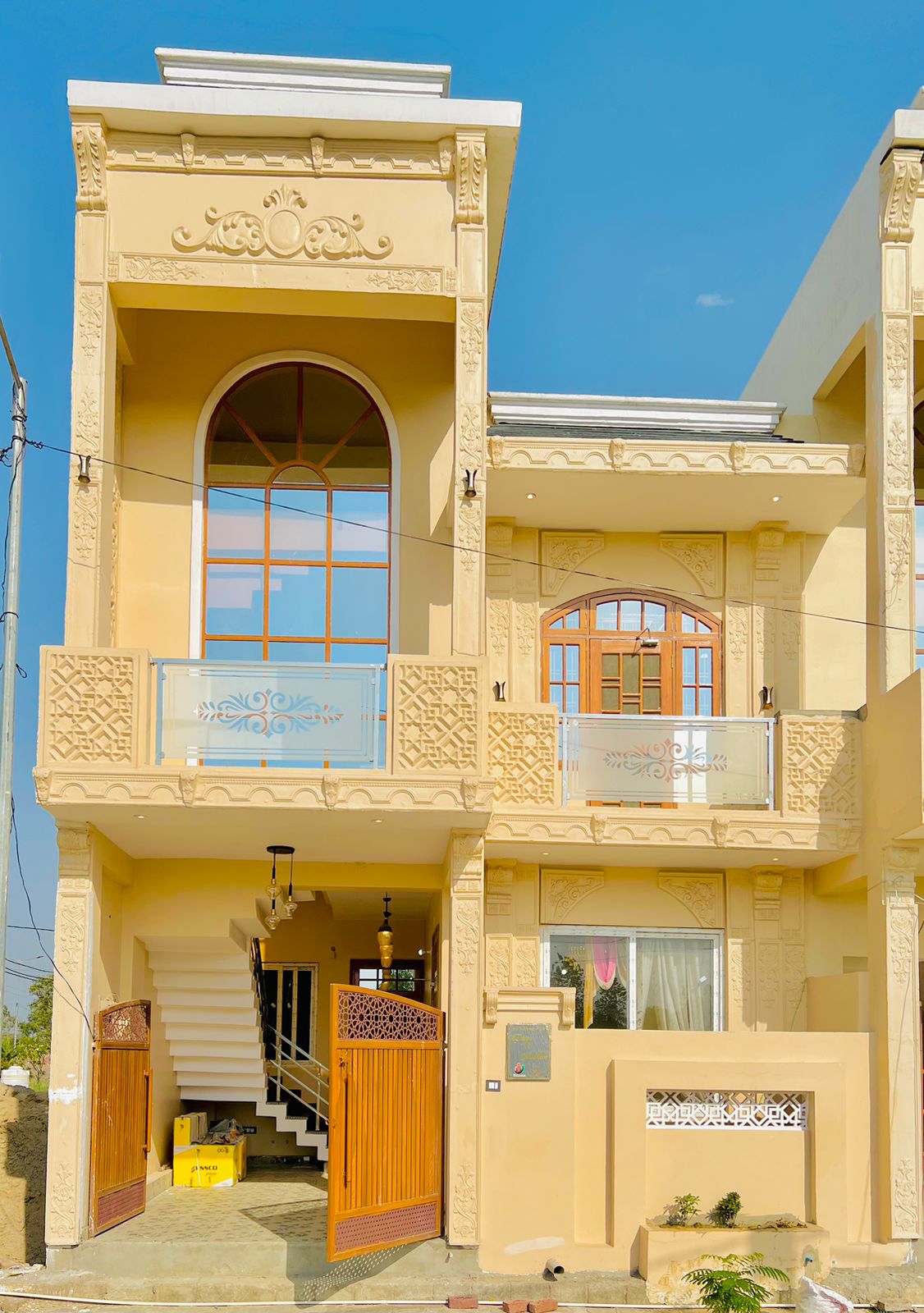 Signature row house at Urbanaid Uniworld with a hand-carved sandstone facade